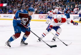 Jan 22, 2022; Denver, Colorado, USA; Colorado Avalanche center Alex Newhook (18) controls the puck against Montreal Canadiens defenseman Brett Kulak (77) in the second period at Ball Arena. Mandatory Credit: Isaiah J. Downing-USA TODAY Sports  When the playoffs start, Colorado’s Alex Newhook will be the only player with a Newfoundland and Labrador connection participating in this year’s playoffs. Isaiah J. Downing-USA TODAY Sports