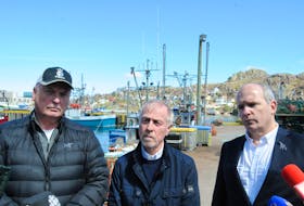 At a press conference on the south side of St. John's Harbour on May 20, members of the Seaward Enterprises Association of Newfoundland and Labrador (SEA-NL) called for a commission of inquiry on fishing vessel safety. Left to right are: fisherman Bruce Layman, safety advocate Merv Wiseman and executive director Ryan Cleary. -Photo by Joe Gibbons/The Telegram