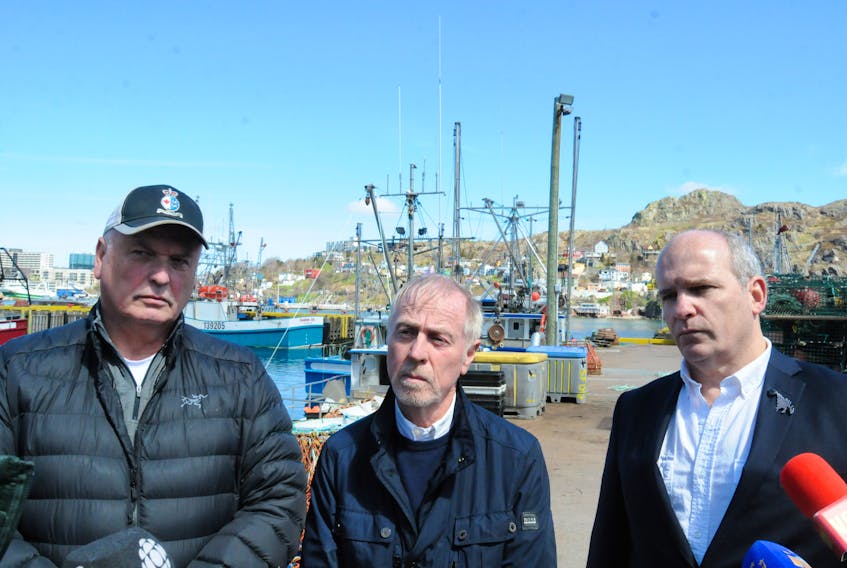 At a press conference on the south side of St. John's Harbour on May 20, members of the Seaward Enterprises Association of Newfoundland and Labrador (SEA-NL) called for a commission of inquiry on fishing vessel safety. Left to right are: fisherman Bruce Layman, safety advocate Merv Wiseman and executive director Ryan Cleary. -Photo by Joe Gibbons/The Telegram