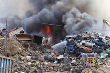 Firefighters battle a large fire at the scrapyard on Dawn Drive in Dartmouth on Friday, May 20, 2022.