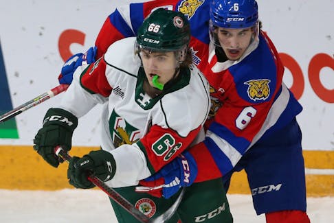Halifax Mooseheads Zachary L'Heureux is wrapped up by Moncton Wildcats Francesco Iasenza during 1st period QMJHL action in Halifax Friday March 4, 2022. 

TIM KROCHAK PHOTO