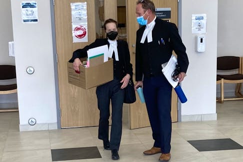 Sarah Kirby and Rick Woodburn, the prosecutors at Kaz Cox's first-degree murder trial, leave Nova Scotia Supreme Court in Dartmouth on Thursday.