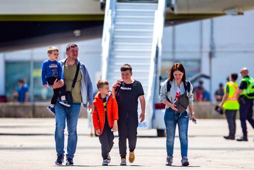A family of Ukraine refugees arrives at Toronto Pearson International Airport on a plane from Poland, on Sunday May 15, 2022.