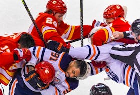 Calgary Flames forward Milan Lucic and Edmonton Oilers forward Evander Kane get into a fight during Game 1 of their second-round playoff series at Scotiabank Saddledome on Wednesday, May 18, 2022. 