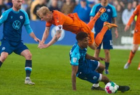Forge FC midfielder Kyle Bekker goes flying after colliding with HFX Wanderers midfielder Andre Rampersad during a Canadian Premier League match at the Wanderers Grounds on Friday, May 20, 2022.  Ryan Taplin - The Chronicle Herald