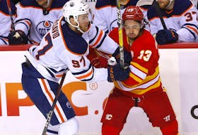 Calgary Flames Johnny Gaudreau battles Edmonton Oilers Connor McDavid in second period action during Round two of the Western Conference finals at the Scotiabank Saddledome in Calgary on Friday, May 20, 2022. 