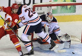 Andrew Mangiapane of the Calgary Flames has a chance in front of goalie Mike Smith of the Edmonton Oilers during the second period of action as the Calgary Flames host the Edmonton Oilers in Game 2 of the second round of the Stanley Cup Playoffs at the Saddledome. Friday, May 20, 2022. 