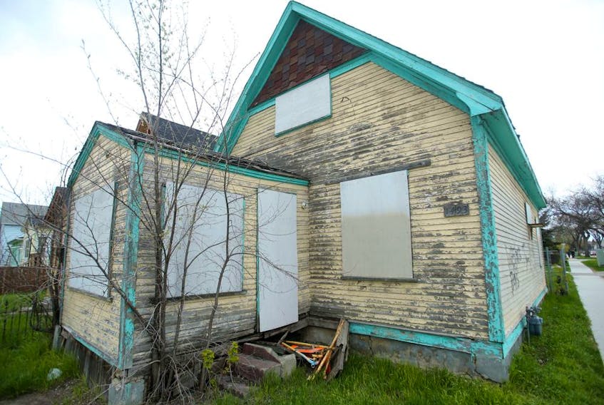 The remains of eight dogs were discovered in this boarded up home in the 1400 block of Ross Ave West in Winnipeg.  The incident is now  described an an animal cruelty investigation Winnipeg Police said Saturday. 