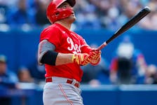 Joey Votto of the Cincinnati Reds hits a solo home run in the eighth inning against the Toronto Blue Jays at Rogers Centre on May 22, 2022 in Toronto. 