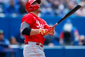 Joey Votto of the Cincinnati Reds hits a solo home run in the eighth inning against the Toronto Blue Jays at Rogers Centre on May 22, 2022 in Toronto. 