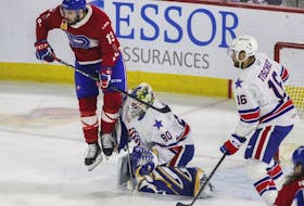 Cédric Paquette of the Laval Rocket screens goalie Aaron Dell of the Rochester Americans in Game One of the AHL North Division final playoff series at Place Bell in Laval on Sunday, May 22, 2022. 