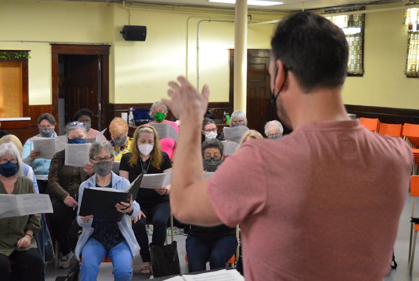 Members of the Cape Breton Chorale, led by artistic director and conductor Ryan Billington, foreground, are seen Thursday preparing for their first full-length spring concert since the COVID-19 pandemic began in 2020. The show, Flowing Waters, takes place May 29 at 8 p.m. at the Church of Christ the King, 19 Trinity Ave., Sydney. The concert will use music, readings and photographs to highlights the human connection to water, with portion of the proceeds donated to organizations dedicated to water security issues, particularly in Indigenous communities across the country. Tickets cost $25 and are available online at www.capebretonchorale.com, from chorale members, by phoning 902-539-1243, or at the door. Chris Connors/Cape Breton Post