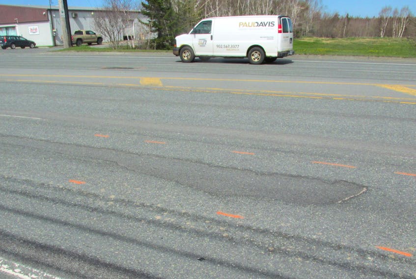 Fred MacIntyre says he started noticing some red dashed markings surrounding several potholes and ruts on the Sydney-Glace Bay highway — “the kids around here make fun of them, calling it ‘hopscotching the Grand Lake Road,’" he says. IAN NATHANSON/CAPE BRETON POST