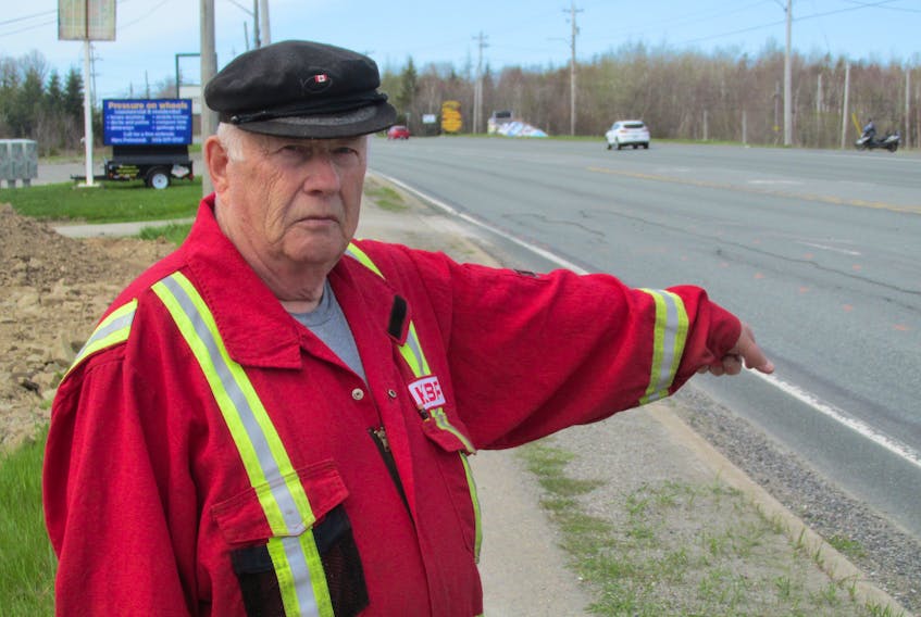 Grand Lake Road resident Fred Macintyre wants to see more than just patching up potholes and ruts along this stretch of the Sydney-Glace Bay highways. "Where is all the money going for the highways? Certainly not along this road," he says. IAN NATHANSON/CAPE BRETON POST