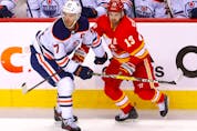  The Calgary Flames’ Johnny Gaudreau battles the Edmonton Oilers’ Connor McDavid in second period action during Game 2 of the second round of the Stanley Cup Playoffs at the Scotiabank Saddledome in Calgary on Friday, May 20, 2022.
