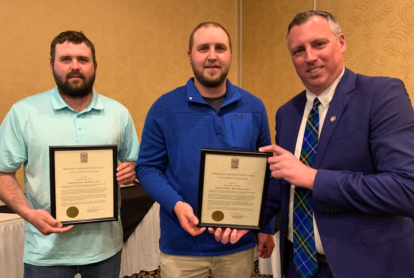 Jonathan and Brandon Millen of J&B Millen Farms Ltd. of Great Village accept the Youth Leader in Agriculture Award from Agriculture Minister Greg Morrow during the presentation of the minister’s awards for excellence on May 19 at a Truro hotel. Darrell Cole