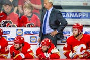  Calgary Flames head coach Darryl Sutter on his bench against the Edmonton Oilers during the third period in Game 1 of the second round of the 2022 Stanley Cup Playoffs at Scotiabank Saddledome on May 18, 2022.