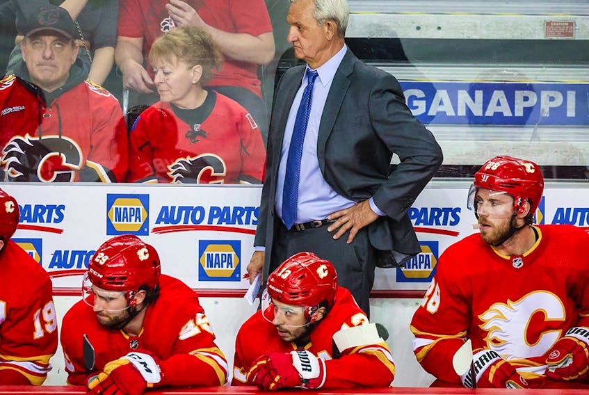  Calgary Flames head coach Darryl Sutter on his bench against the Edmonton Oilers during the third period in Game 1 of the second round of the 2022 Stanley Cup Playoffs at Scotiabank Saddledome on May 18, 2022.