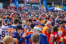 Fans gather in the plaza before the Edmonton Oilers, Calgary Flames playoff hockey game on Sunday, May 22, 2022 in Edmonton. 