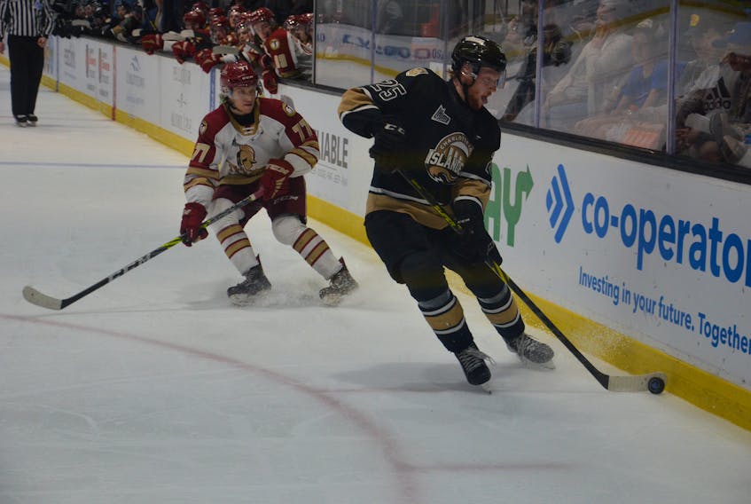 Charlottetown Islanders forward Dawson Stairs, 25, controls the puck while under pressure from the Acadie-Bathurst Titan’s Nolan Forster, 77. The action took place during a Quebec Major Junior Hockey League playoff game at Eastlink Centre in Charlottetown on May 16. The Islanders went on to sweep the best-of-five second-round series. The Islanders host the Sherbrooke Phoenix in Game 1 of the best-of-five semifinal series at Eastlink Centre on May 25 at 7 p.m. Jason Simmonds • The Guardian