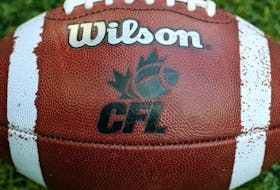 CFL logo on an official Canadian CFL league ball during warm-ups before the Saskatchewan Roughriders CFL game against the Toronto Argonauts on July 11, 2013 at Rogers Centre in Toronto.