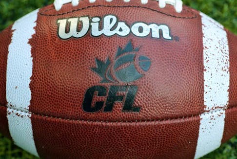 CFL logo on an official Canadian CFL league ball during warm-ups before the Saskatchewan Roughriders CFL game against the Toronto Argonauts on July 11, 2013 at Rogers Centre in Toronto.
