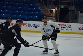 Charlottetown Islanders defenceman Noah Laaouan, white jersey, defends as forwards Owen Saye, right, and Sam Bowness track the puck during a drill at practice on May 22. The Islanders open the best-of-five Quebec Major Junior Hockey League semifinal series against the Sherbrooke Phoenix at Eastlink Centre on May 25 at 7 p.m. Jason Simmonds • The Guardian