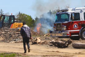 Fire crews on the scene behind an Etter Road address has a battle of small forest fire in Mount Uniacke Tuesday, May 24, 2022.