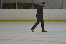 UNB Reds head coach Gardiner MacDougall walks across the ice following the completion of play in a period during an Atlantic University Sport men’s hockey game at MacLauchlan Arena in Charlottetown during the 2021-22 season. MacDougall, from Bedeque, has been named head coach of the Saint John Sea Dogs for the Memorial Cup. The Sea Dogs are hosting the Canadian major junior hockey championship from June 20 to 29. Jason Simmonds • The Guardian