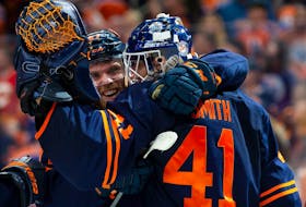  Connor McDavid (97) and goaltender Mike Smith (41) of the Edmonton Oilers celebrate their victory against the Calgary Flames in Game 4 of their Stanley Cup playoff series at Rogers Place on May 24, 2022, in Edmonton.