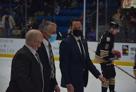 Charlottetown Islanders head coach Jim Hulton, centre, walks towards the dressing room for an intermission during a game at Eastlink Centre earlier this season with associate coach Guy Girouard, left, and assistant coach Kevin Henderson. Hulton was named the Quebec Major Junior Hockey League (QMJHL) coach of the year for the second year in a row on May 26. Jason Simmonds • The Guardian