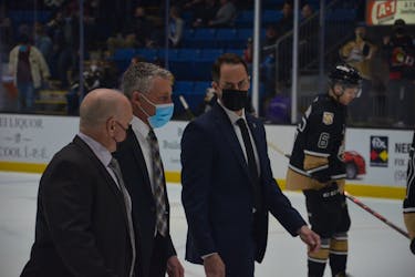 Charlottetown Islanders head coach Jim Hulton, centre, walks towards the dressing room for an intermission during a game at Eastlink Centre earlier this season with associate coach Guy Girouard, left, and assistant coach Kevin Henderson. Hulton was named the Quebec Major Junior Hockey League (QMJHL) coach of the year for the second year in a row on May 26. Jason Simmonds • The Guardian