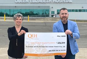 QEH Foundation board chair Patsy MacLean, left, and QEH orthopedic surgeon Dr. Cai Wadden hold a cheque with the fundraising result of the May 25 Big Day of Giving - a 24 hour giving event that made a big impact for the QEH.