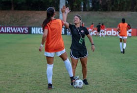 Cindy Tye, right, head coach of Canada’s  under-20 women’s soccer team high-fives player Vivianne Bessett during  a training session. The Canadian team will compete at the 2022 FIFA World Cup in Costa Rica in August. - Audrey Magny