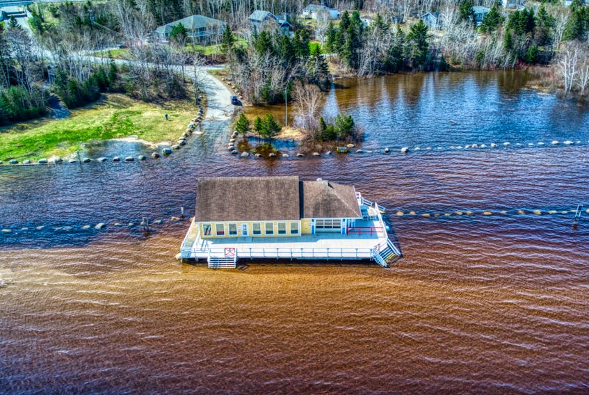 The water level on the Humber River has risen up around the Oasis Grillhouse located on Pasadena Beach. No water has gotten into the building, but it’s pushed back into and beyond the Pasadena restaurant’s parking lot. – Photo by Joe Brazil