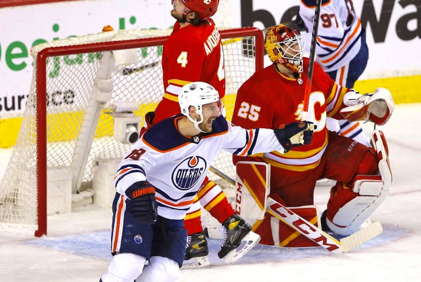 Edmonton Oilers Zach Hyman celebrates their 4th goal on Calgary Flames goalie Jacob Markstrom in second period action during Round two of the Western Conference finals at the Scotiabank Saddledome in Calgary on Thursday, May 26, 2022. 