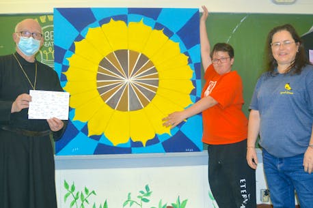 Flower power: Cape Breton youth present sunflower painting to Ukrainian church