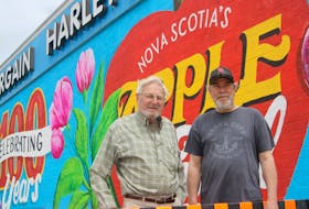 Bargain Harley’s president and owner Harley Moody, left, and Berwick Mural Society member Phil Vogler were impressed with the beautiful mural recently completed at the popular store in the town. It is the society’s second project.