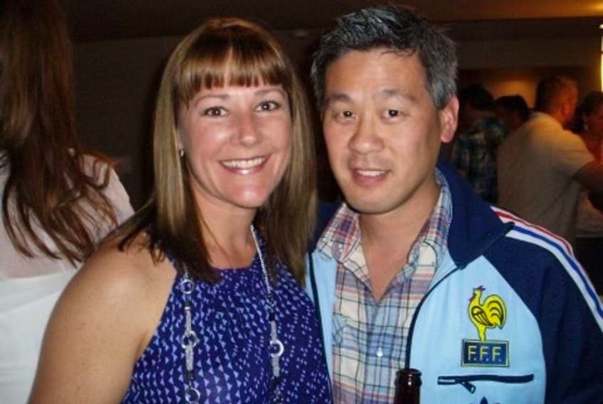A friend's photo shows Robert Hayami, right, with his wife, Kristine McGillivray.