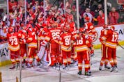  The Calgary Flames celebrate their Game 7 and first-round series-clinching win over the Dallas Stars at the Scotiabank Saddledome in Calgary on May 15, 2022.