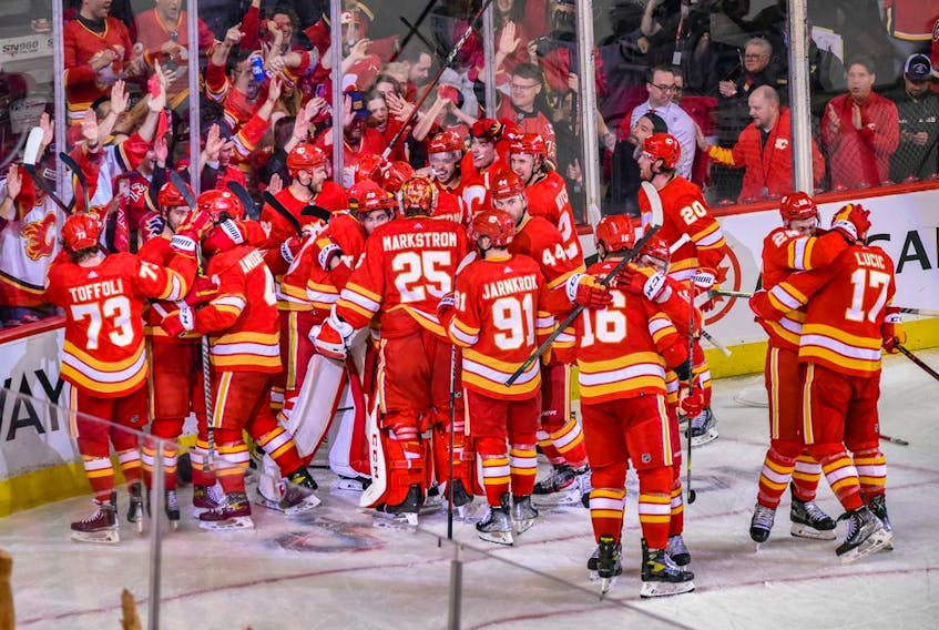  The Calgary Flames celebrate their Game 7 and first-round series-clinching win over the Dallas Stars at the Scotiabank Saddledome in Calgary on May 15, 2022.