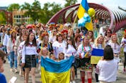 About 250 women walked from the Peace Bridge to Prince's Island Park in Calgary to protest the ongoing Russian invasion of Ukraine on Saturday, May 28, 2022. 