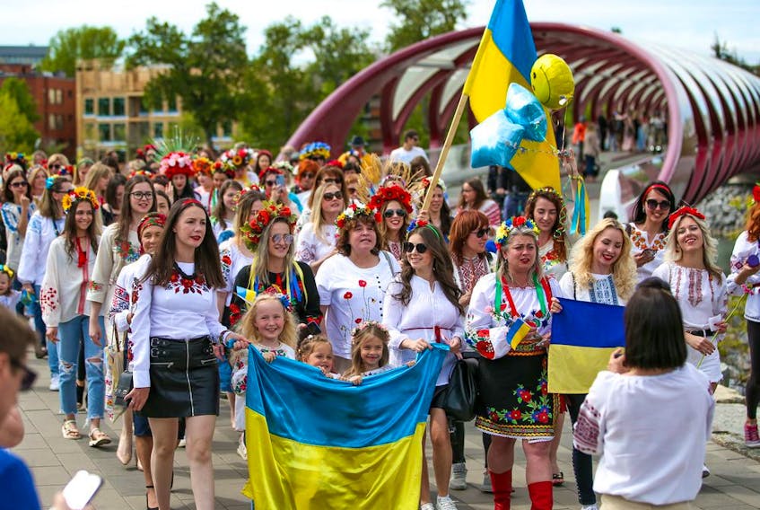About 250 women walked from the Peace Bridge to Prince's Island Park in Calgary to protest the ongoing Russian invasion of Ukraine on Saturday, May 28, 2022. 