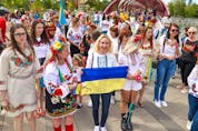  About 250 women walked from the Peace Bridge to Prince’s Island Park in Calgary to protest the ongoing Russian invasion of Ukraine on Saturday, May 28, 2022.