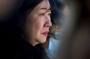  Tear runs down the cheek of Dr. Holly Mah, Chair of Chinatown and Area Business Association, as she attends a Chinatown safety rally outside City Hall, in Edmonton Saturday, May 28, 2022. David Bloom-Postmedia