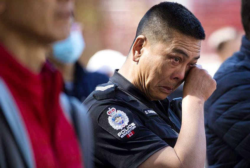  EPS Sgt. David Chow wipes away tears as he attends a Chinatown safety rally outside city hall, in Edmonton Saturday, May 28, 2022. Photo By David Bloom