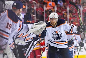 Leon Draisaitl of the Edmonton Oilers celebrates with the bench after scoring against the Calgary Flames during their playoff series, which Edmonton won.