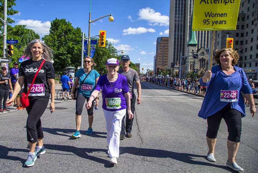 Rejeanne Fairhead strides purposefully towards a Canadian-record time for the 95- to 99-year-old age category in the five-kilometre race on Saturday.