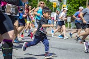Runners take off from the start line of the 2K race on Tamarack Ottawa Race Weekend.