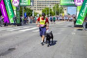 Darrell Furgoch took part in the 5K race with his guide dog on Saturday.